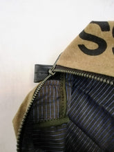 Afbeelding in Gallery-weergave laden, Canvas toiletry bag Amsterdam from recycled military canvas and bicycle inner tube, designed by Anne van Dijk. Photo 3 Interior