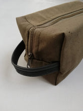 Load image into Gallery viewer, Canvas toiletry bag from recycled military canvas and bicycle inner tube, designed by Anne van Dijk. Photo 3 Hanging Loop
