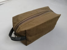 Load image into Gallery viewer, Canvas toiletry bag from recycled military canvas and bicycle inner tube, designed by Anne van Dijk. Photo 1 Frontside
