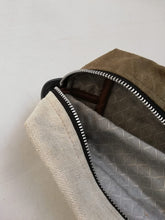 Load image into Gallery viewer, Canvas toiletry bag Amsterdam from recycled military canvas and bicycle inner tube, designed by Anne van Dijk. Photo 2 Interior
