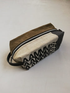 Canvas toiletry bag Amsterdam from recycled military canvas and bicycle inner tube, designed by Anne van Dijk. Photo 4 Backside