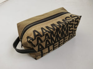 Canvas toiletry bag Amsterdam from recycled military canvas and bicycle inner tube, designed by Anne van Dijk. Photo 1 Frontside
