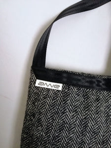 Classy crossbody bag handmade from the sleeve of a reused suit jacket, designed by Anne van Dijk, Color Grey Herringbone, Label close-up