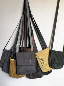 Classy crossbody bag handmade from the sleeve of a reused suit jacket, designed by Anne van Dijk, Photo of the Collection