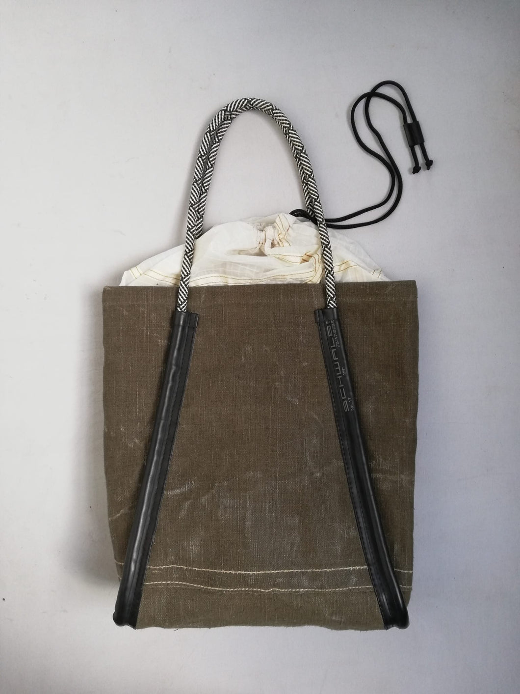Handmade shopping bag from recycled military canvas, parachute and bicycle innertube. designed by Anne van Dijk